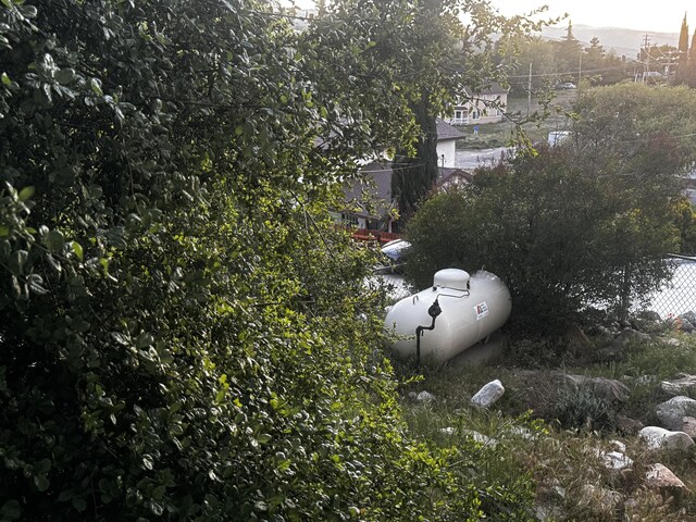 exterior view of propane tank and fence