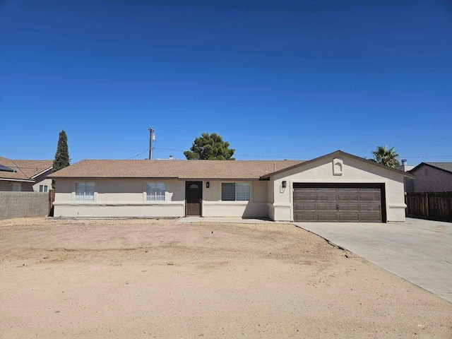 ranch-style home with a garage