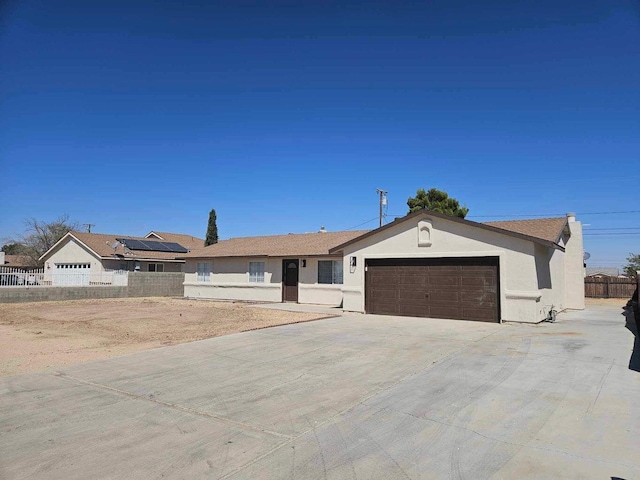 ranch-style home with a garage