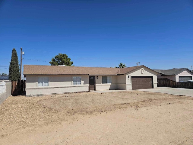 ranch-style home with a garage