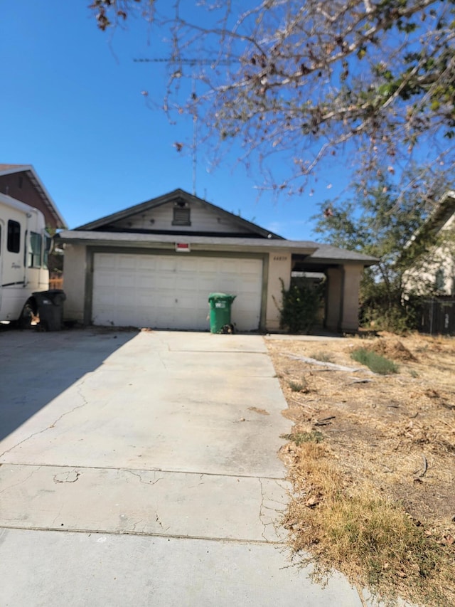 ranch-style house featuring a garage