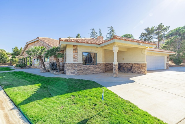 view of front of house with a garage and a front lawn