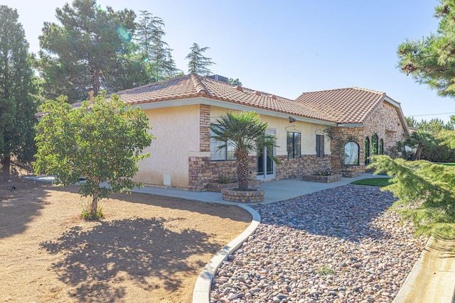 view of front of home with a patio