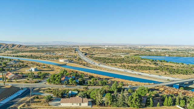 bird's eye view featuring a water and mountain view