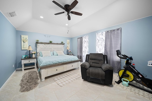 tiled bedroom with ceiling fan and lofted ceiling