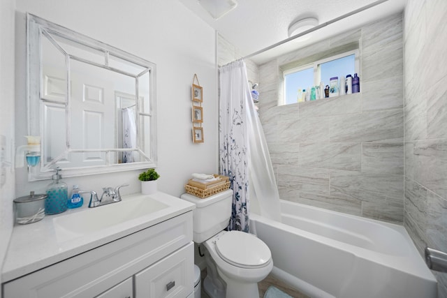 full bathroom featuring vanity, shower / bath combo, and toilet