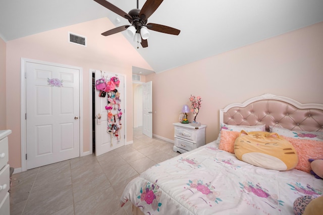 tiled bedroom featuring ceiling fan and vaulted ceiling