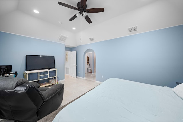 tiled bedroom with ceiling fan and lofted ceiling