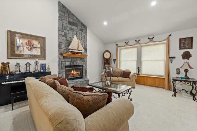 living room with lofted ceiling, a fireplace, and light carpet