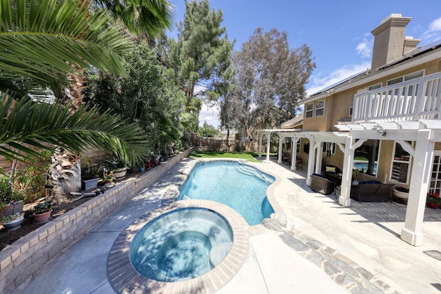 view of pool with a pergola, a pool with connected hot tub, a fenced backyard, an outdoor living space, and a patio