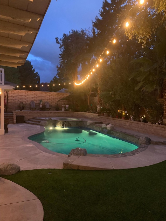 view of swimming pool featuring a fenced in pool, a patio, and a fenced backyard