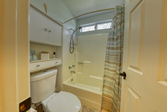 bathroom with shower / bath combination with curtain and toilet
