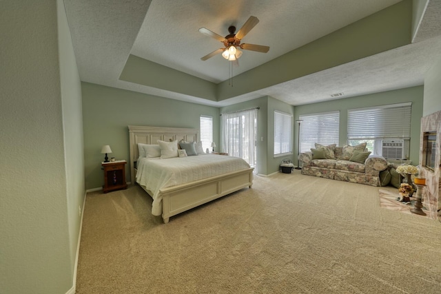 bedroom with a textured ceiling, baseboards, and carpet