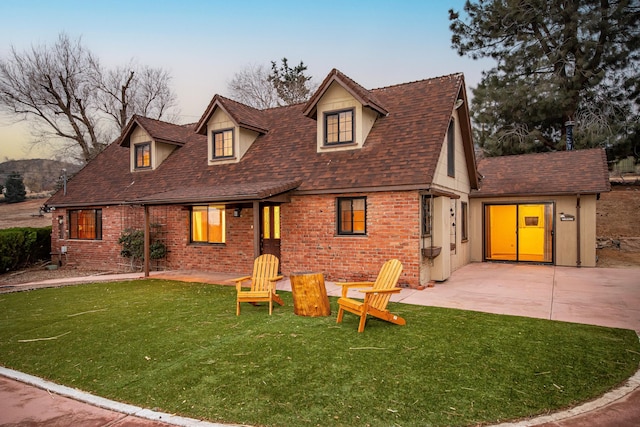 exterior space with a lawn and a patio