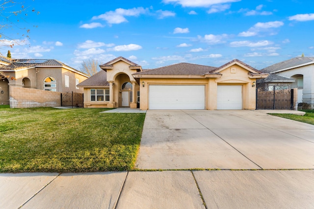 view of front of home featuring a front yard, fence, driveway, an attached garage, and stucco siding