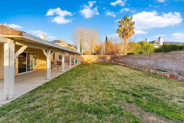 view of yard featuring a patio and a fenced backyard