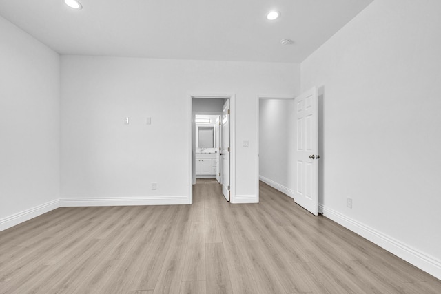 2929 W 28th St, Rosamond, CA 93560 - unfurnished bedroom featuring light wood-style flooring, baseboards, recessed lighting, and ensuite bath