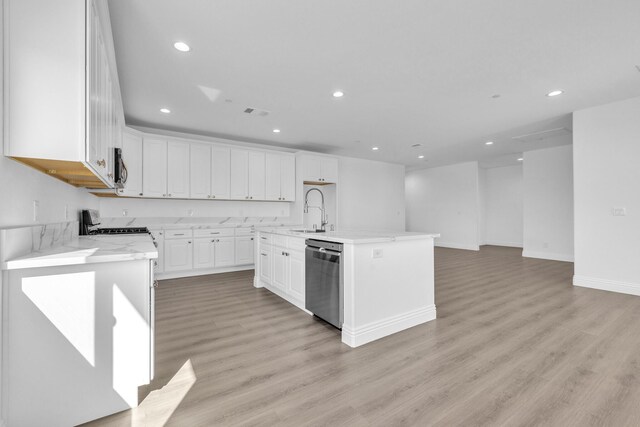 2929 W 28th St, Rosamond, CA 93560 - kitchen with stainless steel appliances, a sink, recessed lighting, and white cabinetry