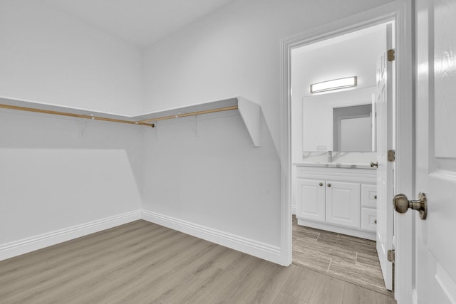 2929 W 28th St, Rosamond, CA 93560 - walk in closet with light wood-style floors