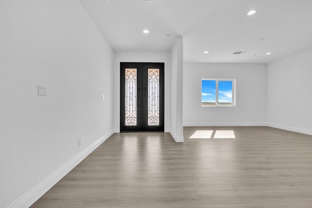 2929 W 28th St, Rosamond, CA 93560 - foyer with french doors, wood finished floors, recessed lighting, and baseboards