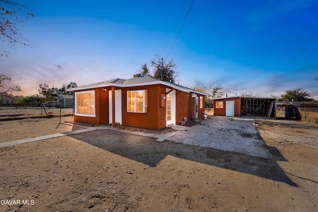 43331 Fairglen Rd, Lancaster, CA 93535 - view of front of house with an outdoor structure and stucco siding