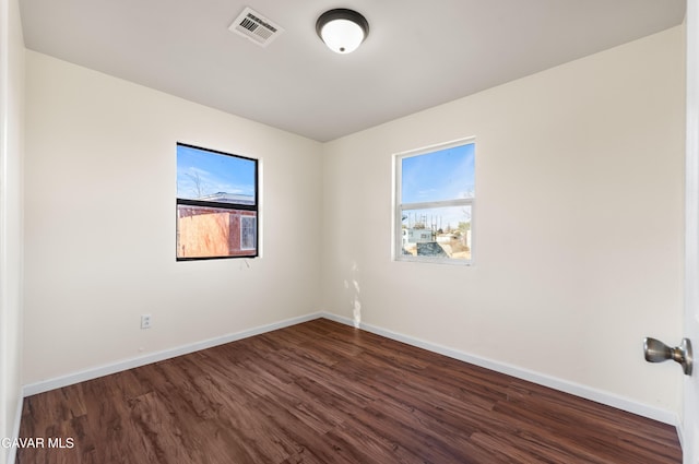 43331 Fairglen Rd, Lancaster, CA 93535 - unfurnished room with plenty of natural light and dark wood-style flooring