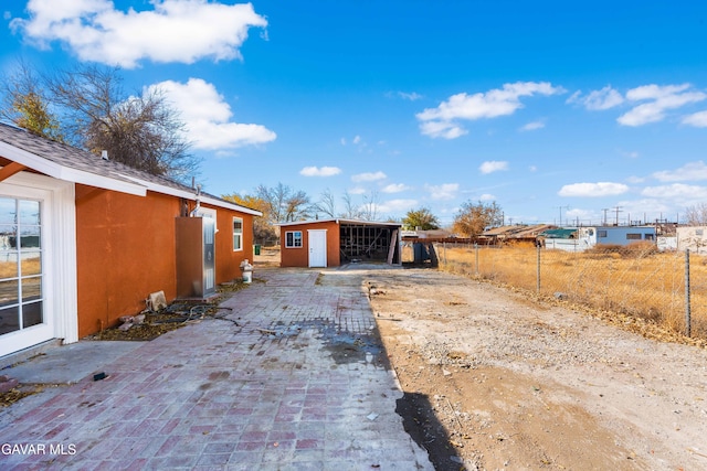 43331 Fairglen Rd, Lancaster, CA 93535 - view of home's exterior with an outbuilding, stucco siding, and driveway