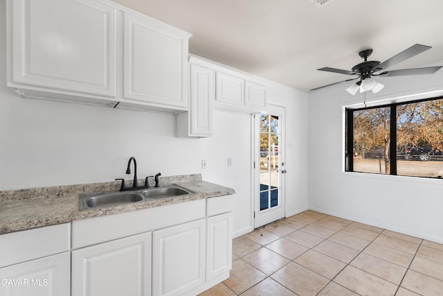 43331 Fairglen Rd, Lancaster, CA 93535 - kitchen featuring a ceiling fan, light tile patterned floors, and white cabinetry