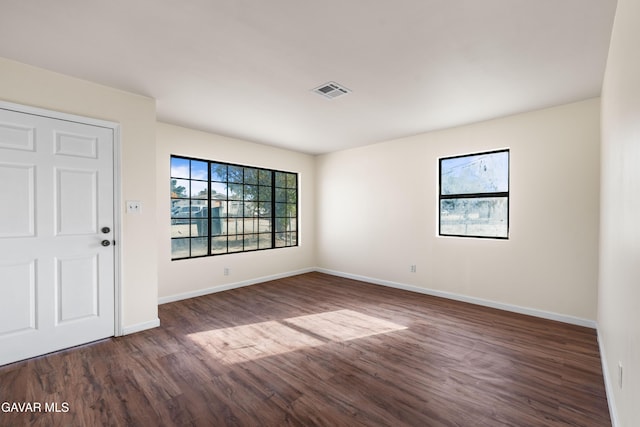 43331 Fairglen Rd, Lancaster, CA 93535 - empty room with dark wood-style floors and baseboards