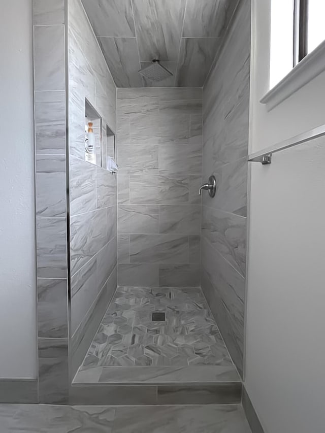 42722 W 20th St, Lancaster, CA 93534 - bathroom featuring marble look tiles and a tile shower