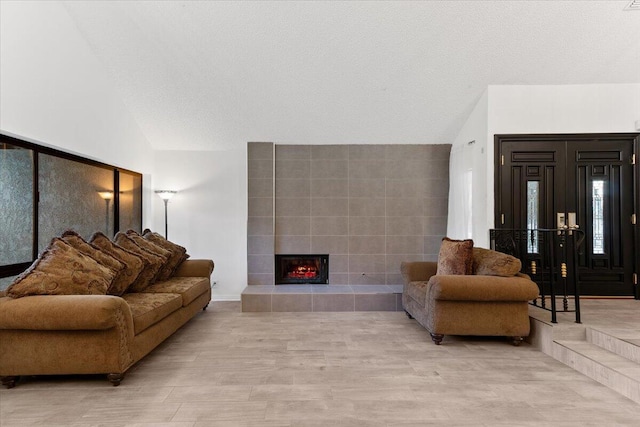 42722 W 20th St, Lancaster, CA 93534 - living area with high vaulted ceiling, a tile fireplace, a chandelier, beamed ceiling, and baseboards