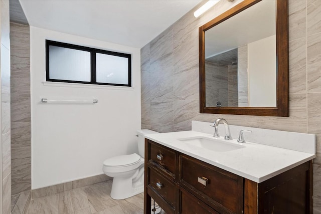 42722 W 20th St, Lancaster, CA 93534 - full bathroom featuring tile walls, toilet, vanity, marble finish flooring, and a shower