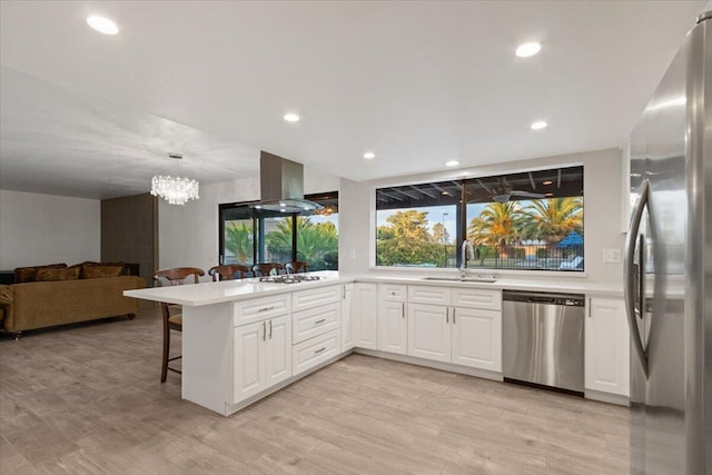 42722 W 20th St, Lancaster, CA 93534 - kitchen with stainless steel dishwasher, a sink, plenty of natural light, white cabinetry, and recessed lighting