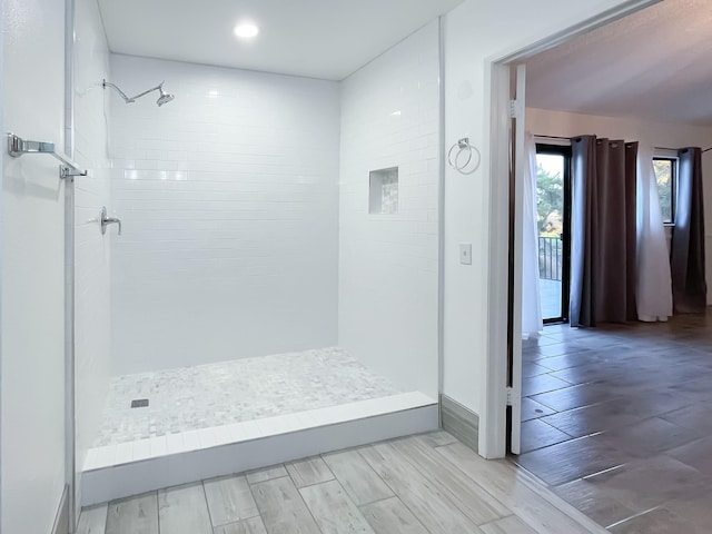 42722 W 20th St, Lancaster, CA 93534 - bathroom featuring a tile shower, wood finished floors, and vanity