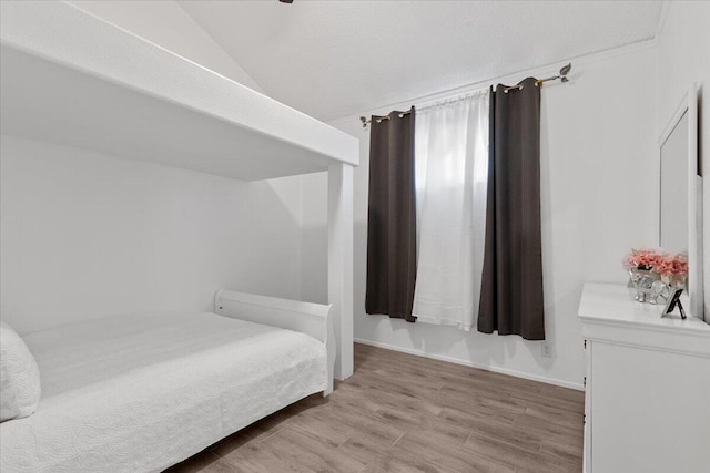42722 W 20th St, Lancaster, CA 93534 - bedroom featuring vaulted ceiling, light wood-style floors, and baseboards