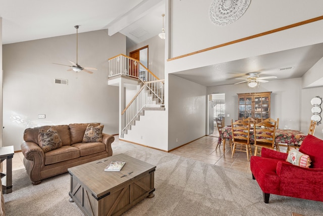 carpeted living room with stairs, beam ceiling, visible vents, high vaulted ceiling, and tile patterned floors