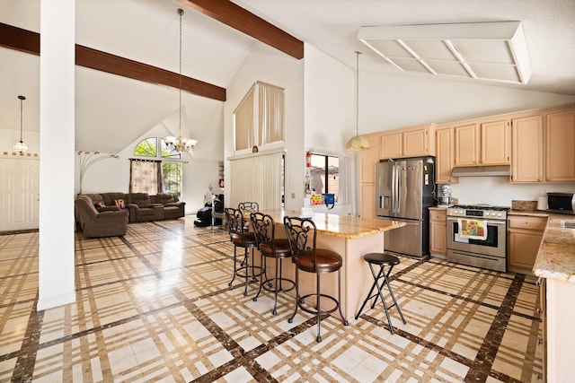 kitchen with light stone counters, a chandelier, hanging light fixtures, a kitchen breakfast bar, and stainless steel appliances