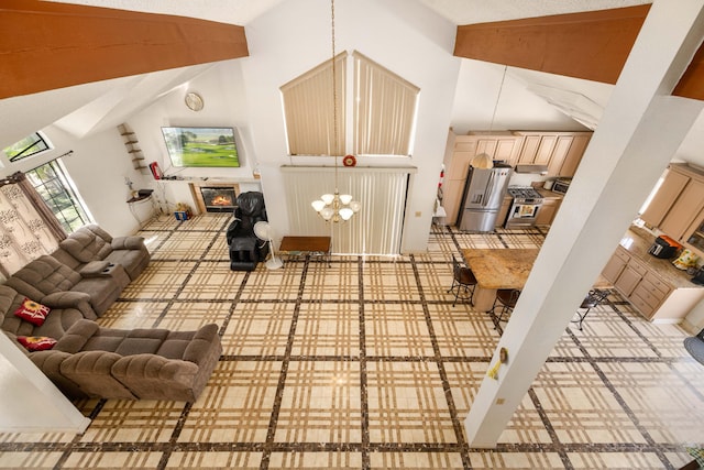 living room featuring high vaulted ceiling