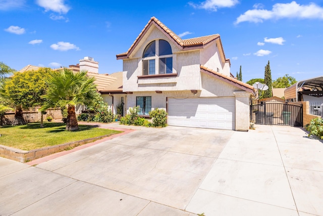 view of front of property featuring a garage and a front yard