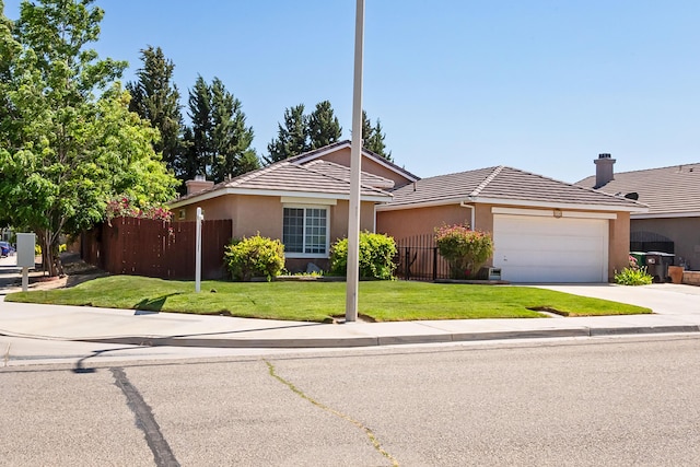 6310 Treehaven Ct, Lancaster, CA 93536 - ranch-style house with an attached garage, driveway, stucco siding, and a tile roof