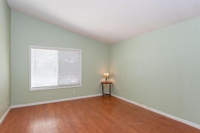 6310 Treehaven Ct, Lancaster, CA 93536 - spare room featuring wood finished floors and vaulted ceiling