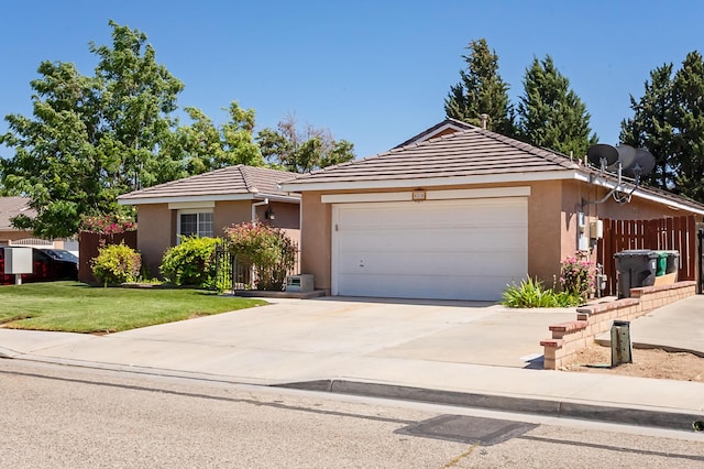 6310 Treehaven Ct, Lancaster, CA 93536 - ranch-style house featuring stucco siding, a garage, a tile roof, and driveway