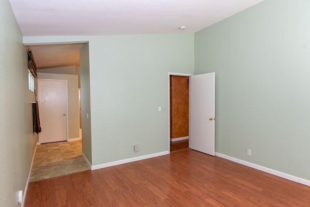 6310 Treehaven Ct, Lancaster, CA 93536 - unfurnished room with wood finished floors and vaulted ceiling