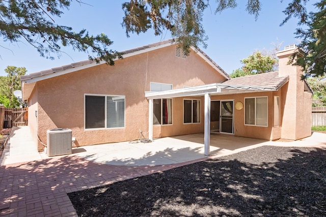 6310 Treehaven Ct, Lancaster, CA 93536 - rear view of house featuring stucco siding, a tile roof, a patio area, and a chimney