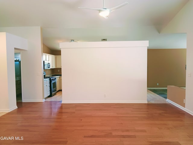 6310 Treehaven Ct, Lancaster, CA 93536 - empty room featuring lofted ceiling, light wood-style floors, and a ceiling fan