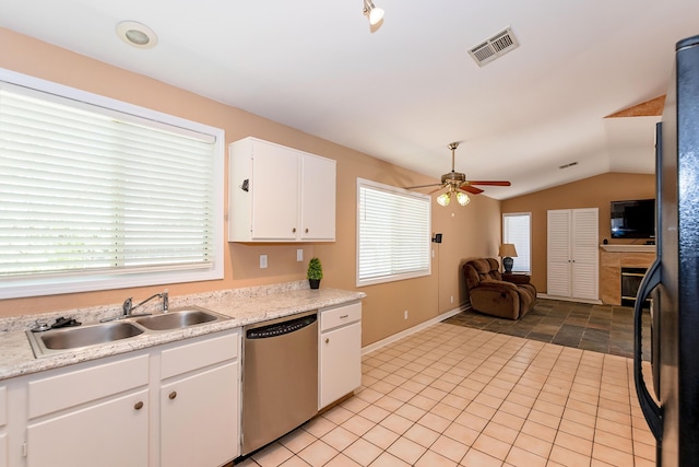 6310 Treehaven Ct, Lancaster, CA 93536 - kitchen with stainless steel dishwasher, light countertops, a ceiling fan, white cabinetry, and lofted ceiling