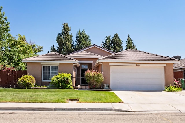 6310 Treehaven Ct, Lancaster, CA 93536 - single story home with concrete driveway, an attached garage, stucco siding, and a tiled roof