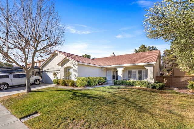 view of front of property featuring a front lawn and a garage