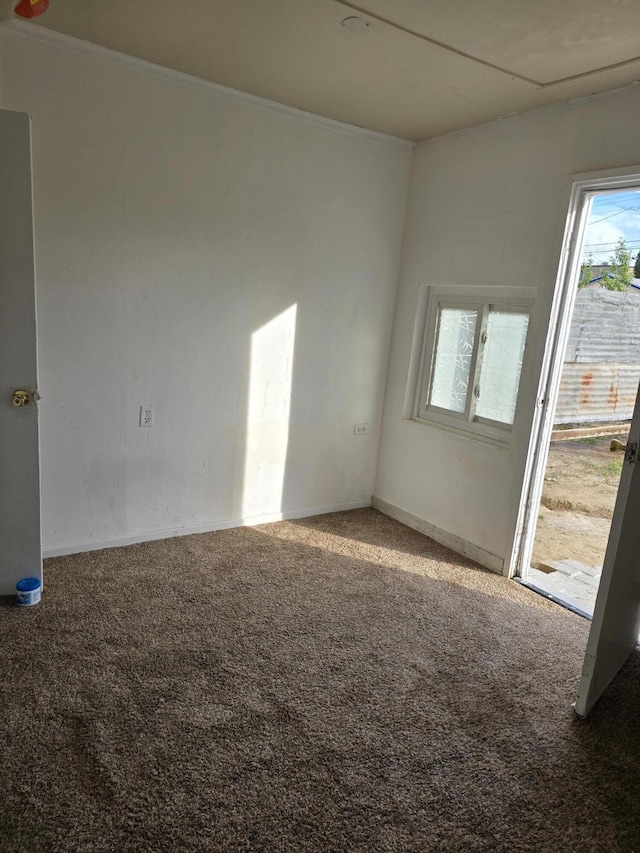 127 N St, Taft, CA 93268 - spare room with carpet, baseboards, and crown molding