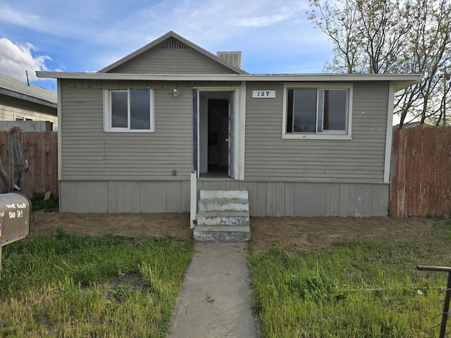 view of front of house with fence